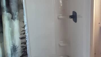 Shower, towels, soap, toilet paper