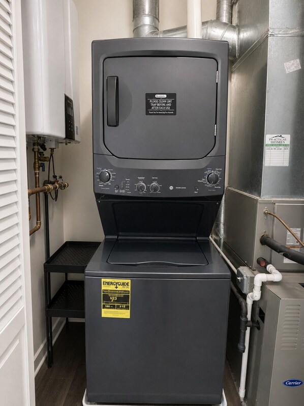 A practical homes water heater with a control panel, a removable top, and a label indicating energy efficiency.