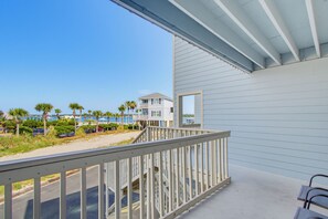 A beachfront property with a balcony, a view of the beach, and a building with a balcony. - Summer House West B105 (Gulf Shores)