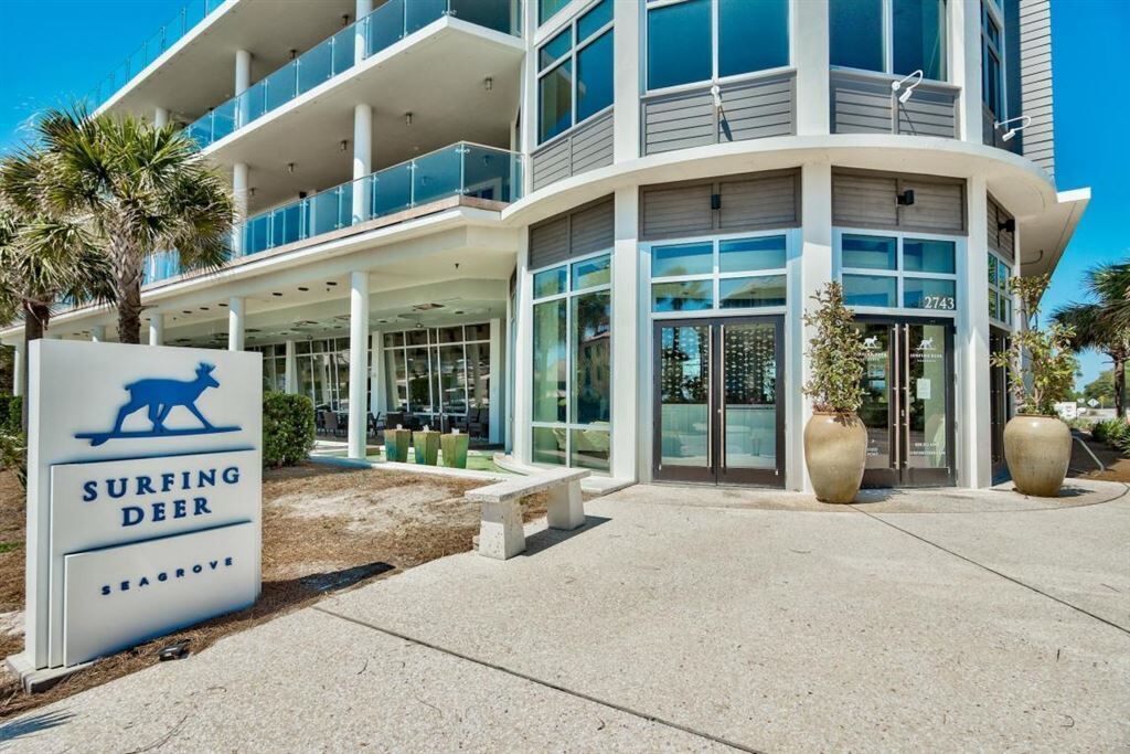 A modern building with a sign reading 'Surfing Deer' and the number 2743.