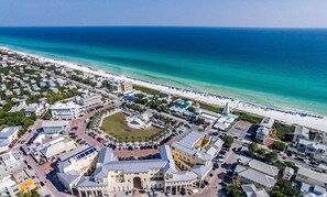 An aerial view of a coastal town with a central plaza, beachfront, and residential buildings. - Adorable Old Seagrove Beach Cottage Bordering Seaside Near Beach Access (Santa Rosa Beach)