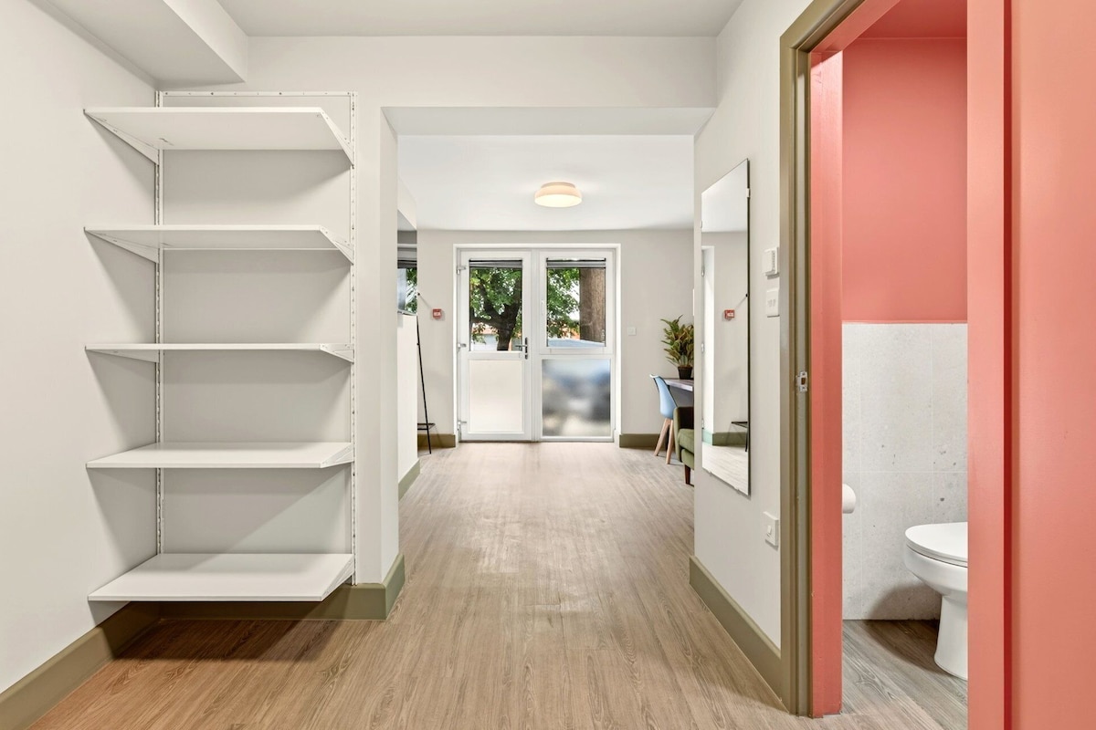 Apartment (One-Bedroom Apartment) | Desk, laptop workspace, bed sheets