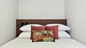 Apartment (One-Bedroom Apartment) | Desk, laptop workspace, bed sheets