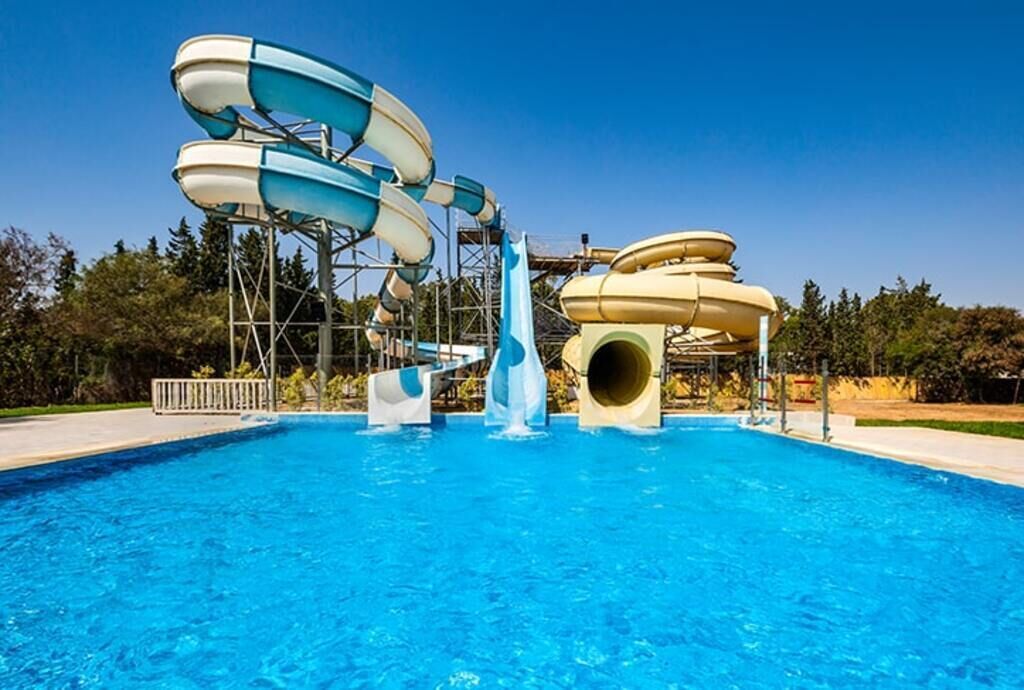 Indoor pool, outdoor pool, pool umbrellas, pool loungers