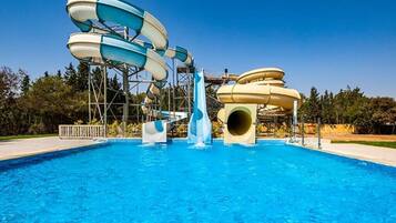 Indoor pool, outdoor pool, pool umbrellas, pool loungers