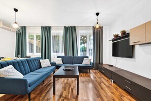 TV, offices - Family Stay in Old Town with Private Parking (Bratislava)