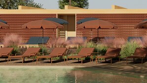 A poolside area with lounge chairs and umbrellas. - Aura By Aubamar (Palma de Mallorca)