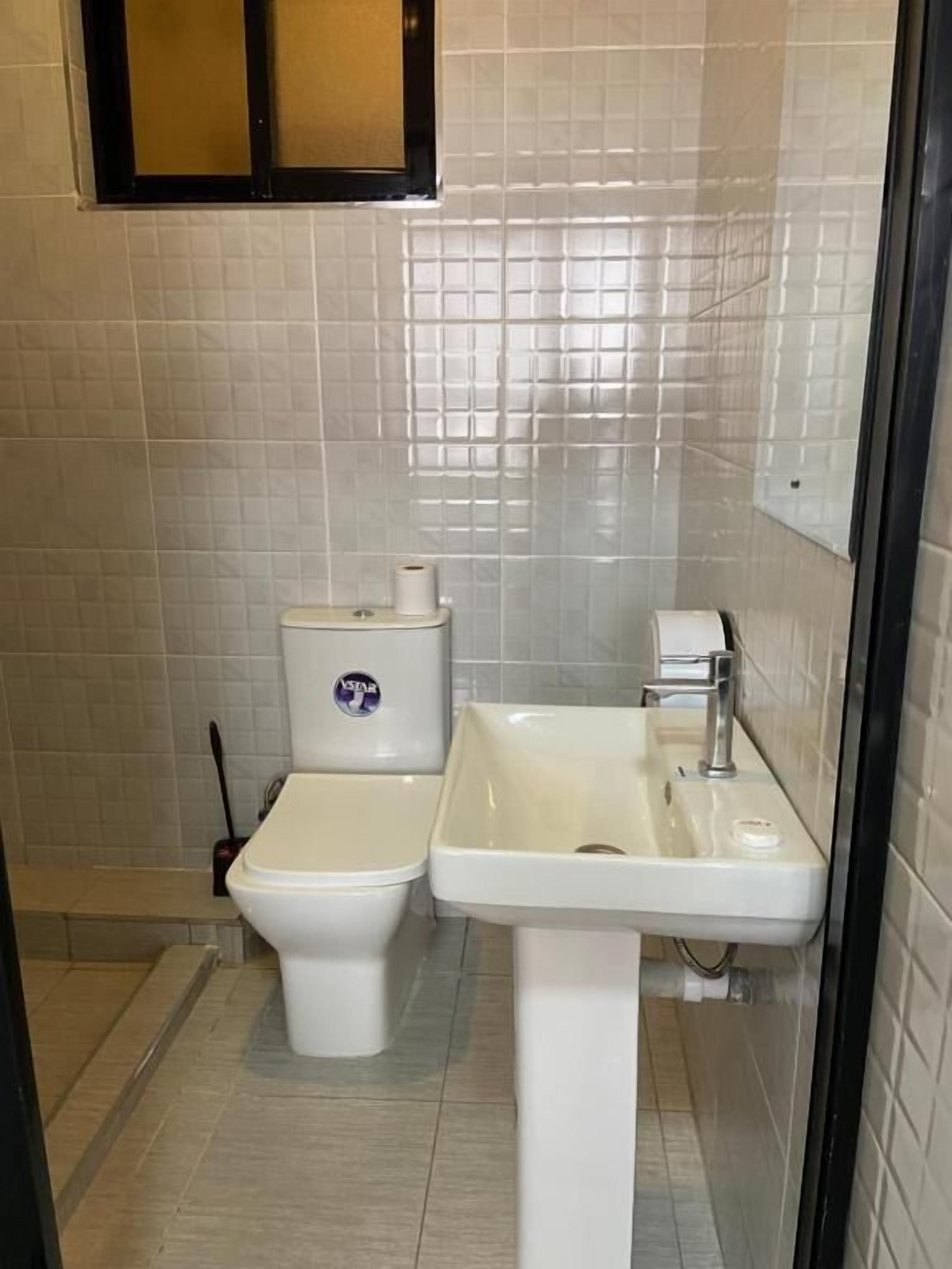 Standard Double Room | Bathroom | Shower, free toiletries, slippers, towels