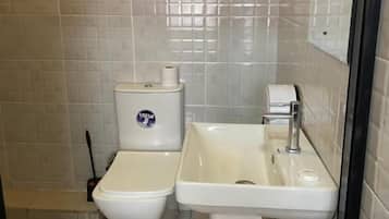 Standard Double Room | Bathroom | Shower, free toiletries, slippers, towels