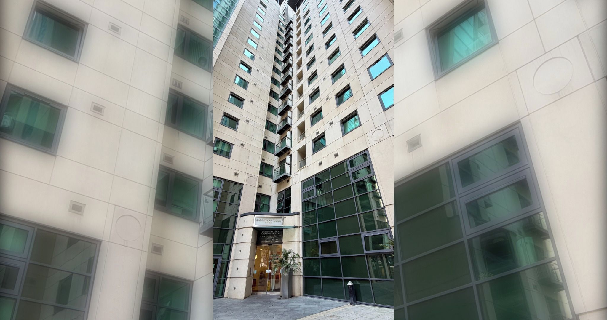 Un immeuble de grande hauteur, doté de nombreux étages, de grandes fenêtres et d’une entrée centrale.