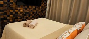 Apartment with hot tub, heater, and dry sauna.
