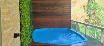 Apartment with hot tub, heater, and dry sauna.