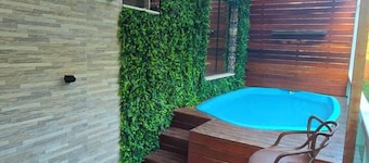 Apartment with hot tub, heater, and dry sauna.