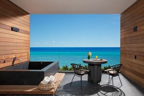 A balcony with a view of the ocean, a bathtub, and two chairs. - Secrets Moxché Playa del Carmen Adults-Only Luxury All-Inclusive Paradise (Playa del Carmen)
