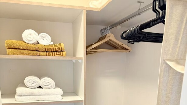 A walk-in closet with shelves, a hanging rack, and a laundry basket. - 2-bedroom apartment w/ sunset view - Pool - Gym, beautiful Barranco y Miraflores (Lima)
