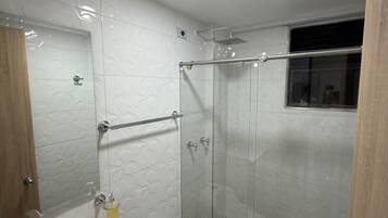 Shower, towels, soap, toilet paper