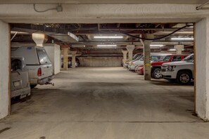 A multi-level underground parking garage with concrete pillars and overhead lighting. - Der Steiermark 104 in Breckenridge (Breckenridge)