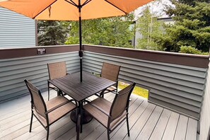 A deck with a table and chairs, surrounded by a railing. - New Listing! Budget Friendly, Prime Location, Private Deck (Telluride)