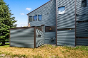 A modern two-story building with a sloped roof and horizontal siding. - New Listing! Budget Friendly, Prime Location, Private Deck (Telluride)