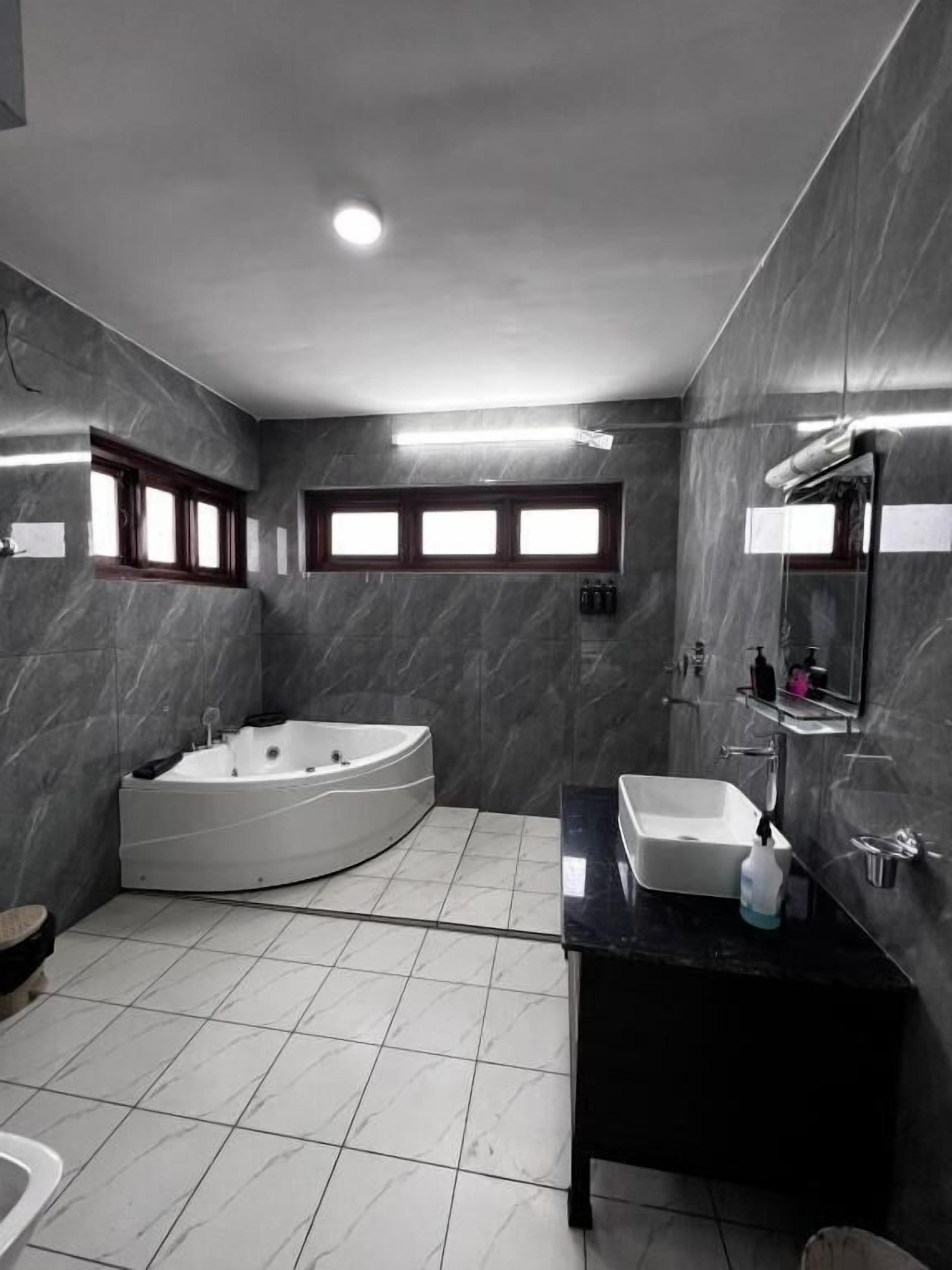 Shower, hair dryer, slippers, towels
