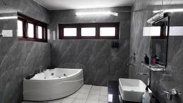 Shower, hair dryer, slippers, towels