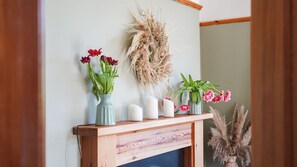 A fireplace mantel with vases and candles. - Tranquil countryside cottage (Wrexham)