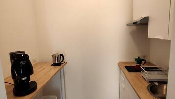 Espresso maker, coffee/tea maker, mini-fridge, microwave