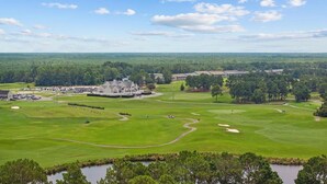A golf course with a clubhouse, multiple buildings, and a large parking area. - Myrtle Golf Escape At Legends-pool-pet Friendly (Myrtle Beach)