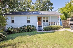 A single-story house with a front porch, a small deck, and a garage. - Shem Shack-old Village, 5 Mins to Beach (Mount Pleasant)