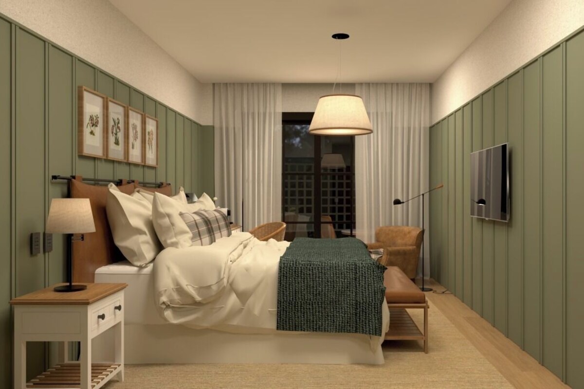 A bedroom with a bed, bedside tables, a chair, a TV, and a window with curtains.