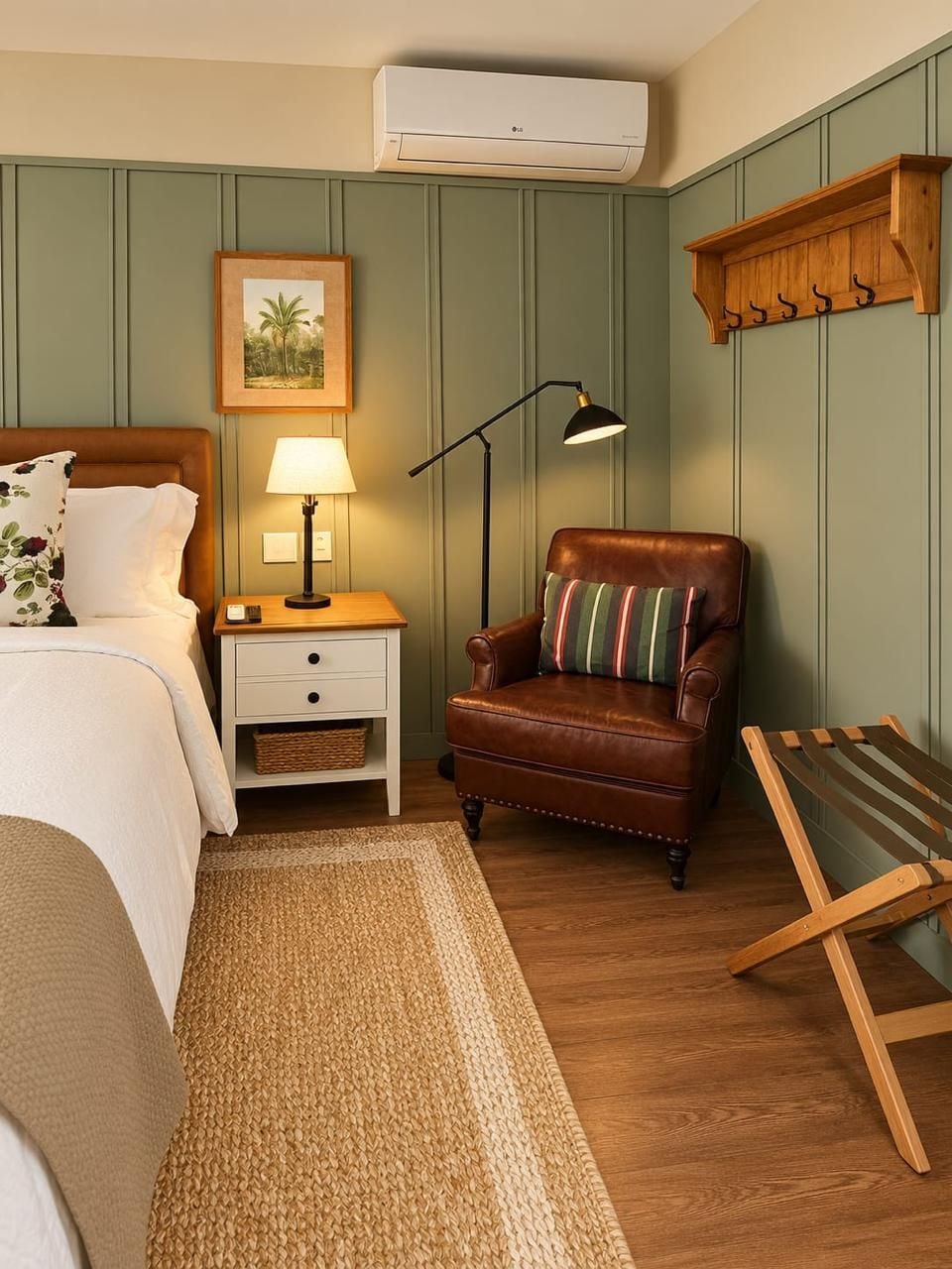A bedroom with a bed, bedside table with lamp, chair, and a wooden bench.