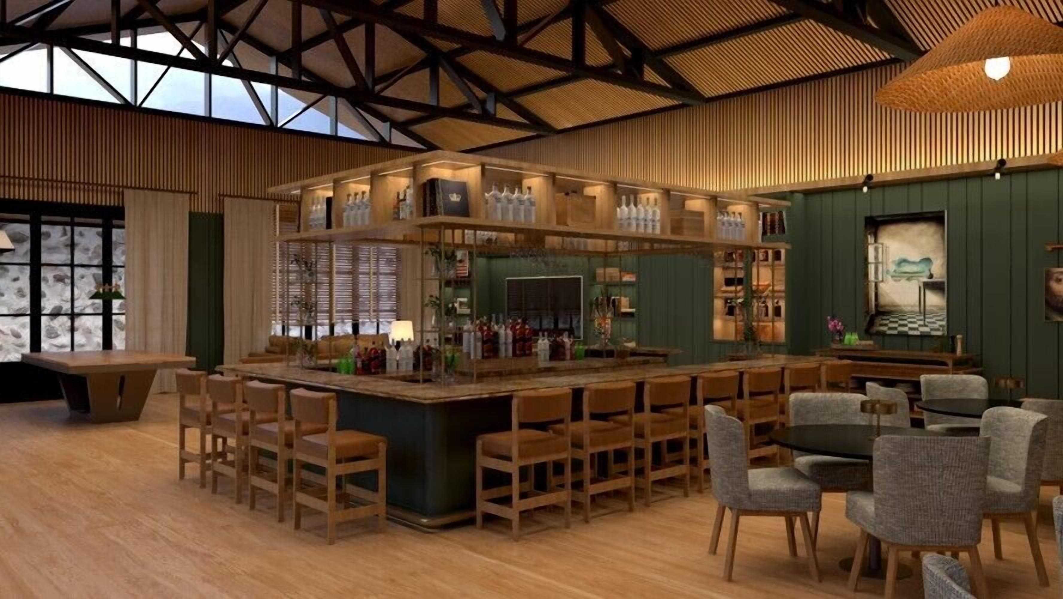 A bar area with wooden furniture and a bar counter, featuring a variety of bottles and glasses.