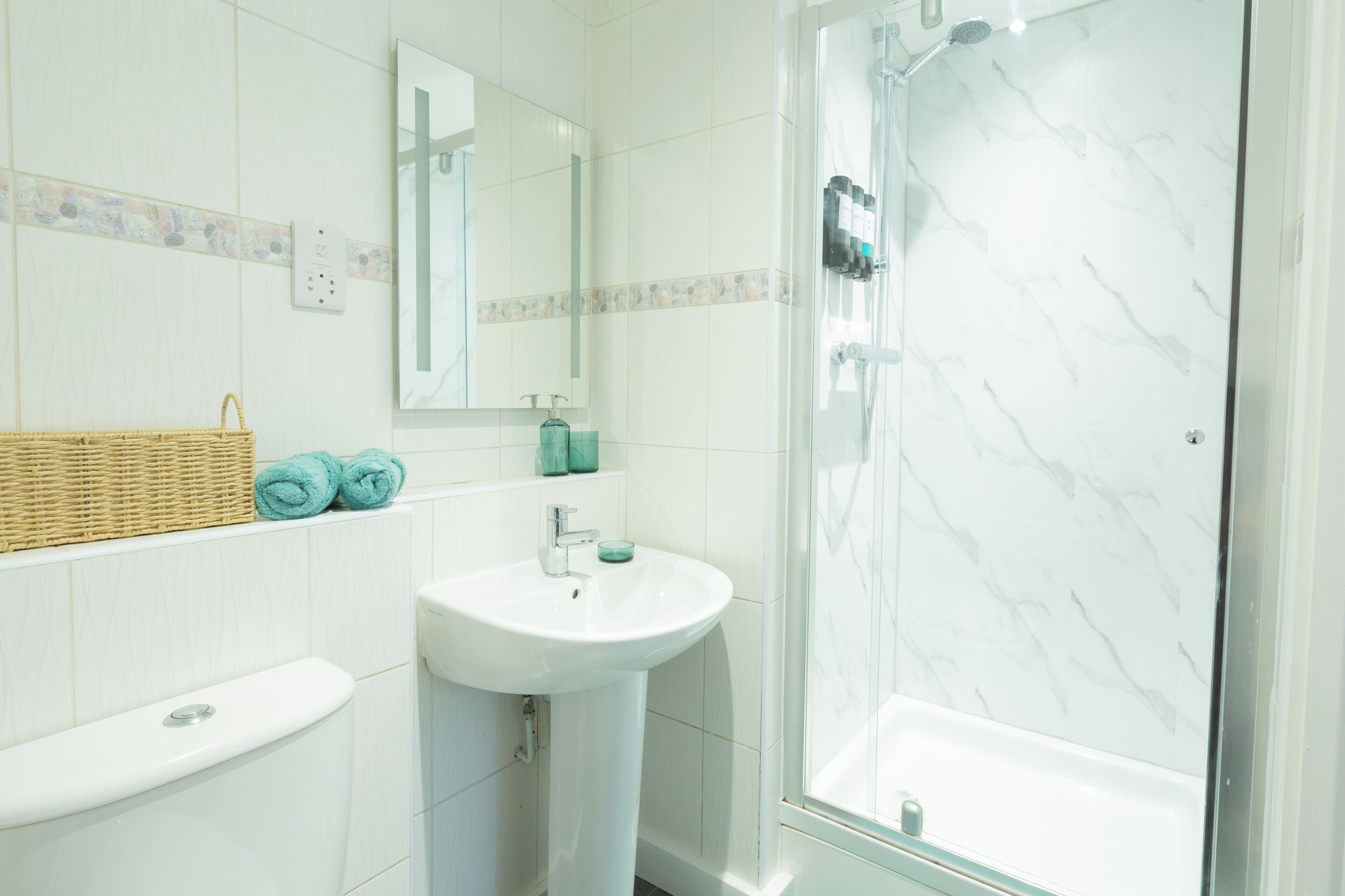 Shower, hair dryer, towels, soap
