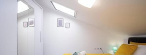 A room with a bed, a desk, a chair, a window, and a door. - Megy Apartment with Ocean View, Medulin (Marčana)