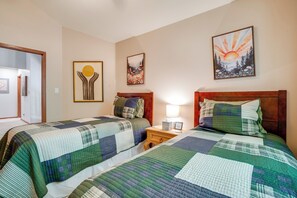 A hotel room with two beds, a nightstand, and three wall-mounted artworks. - Private Deck & Hot Tub! Family Sanctuary in Frisco (Frisco)