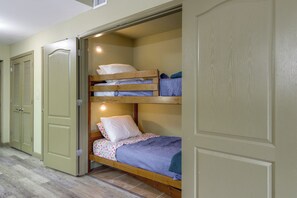 A bunk bed with two levels, a door with a handle, and a tiled floor. - Mtn Views, Pool Access! Walkable Gem Near Parkway (Pigeon Forge)