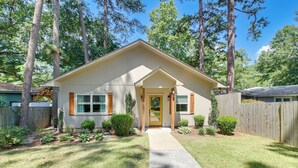 A single-story house with a front porch, a small front yard, and a wooden fence. - Lakefront Gem w/ Boat Dock! 6 Mi to Hot Springs NP (Hot Springs)