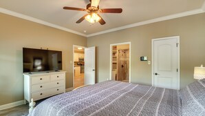 A bedroom with a bed, dresser, television, and a ceiling fan. - Lakefront Gem w/ Boat Dock! 6 Mi to Hot Springs NP (Hot Springs)