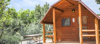 Rustic Cabin (Sleeps 2) - The Camping Cabin sleeps a maximum of 2. Bring your own linens.