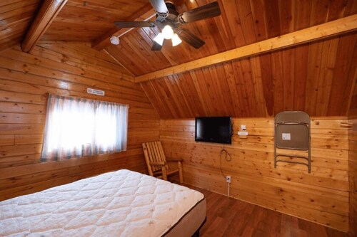 Rustic Cabin (Sleeps 2) - The Camping Cabin sleeps a maximum of 2. Bring your own linens.