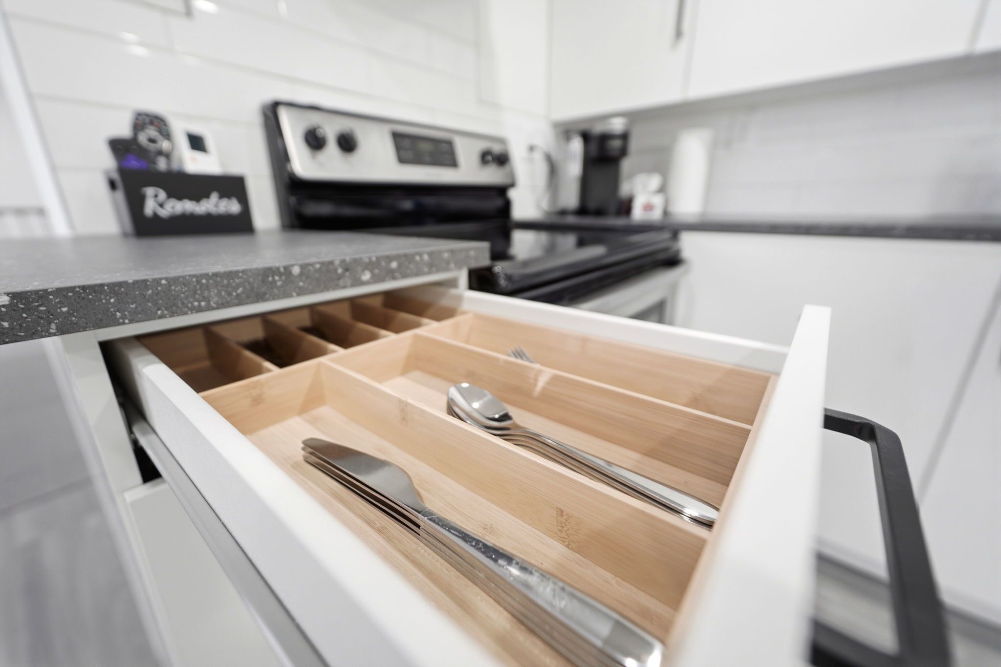A kitchen drawer with utensils.