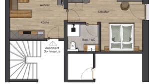A floor plan with a kitchen, dining area, living room, two bedrooms, bathroom, and a staircase. - Maashof (Galtür)