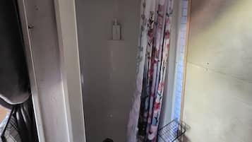 Shower, towels, soap, toilet paper