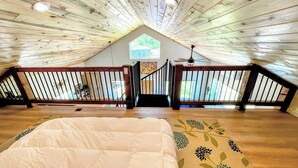 An attic bedroom with a wooden ceiling, a bed, a window, and a view of the outside. - Hermosa Meadows Hideaway - 360° Red Cliff Views, Sleeps 5, 10 min to Durango (Durango)