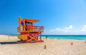 A lifeguard tower on a beach with clear skies and calm waters. - Spacious Miami Beach 1BR • Beach Access • Sleeps 3 (Miami Beach)