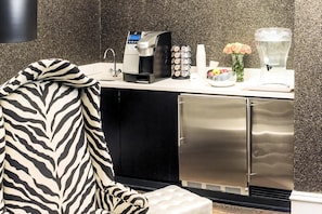 A kitchenette with a coffee maker, sugar, and a fruit bowl. - Deluxe King | Moderne | Midtown Boutique Stay | Near Times Square | 2 Units (New York)