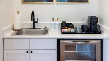 Coffee/tea maker, fridge, cookware/dishes/utensils