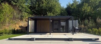 Private wellness lodge on Lake E with air conditioning, a pool, a hot tub, and a sauna