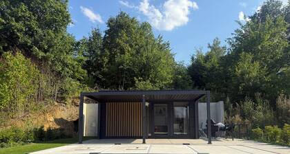 Private wellness lodge on Lake E with air conditioning, a pool, a hot tub, and a sauna