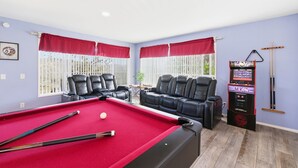 A pool room with a pool table, two leather sofas, a pool cue rack, and a video game machine. - Natures Escape - Game Room, Spa, Sauna, OMG Views! (Escondido)